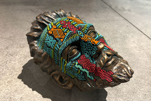 Carlos Castro, Artisanal Vandalism. (2023) Amazon conquistador Francisco de Orellana sculpture, intervened with beads using symbols of the Inga culture of Columbia’s Putumayo. Based on a work from the 1950’s by the sculptor Luis Pinto Maldonado.