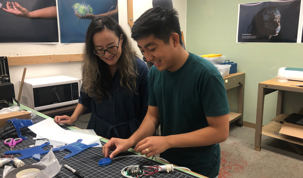 Professor Yin Yu in her studio with student researcher Brad Dela Llana.