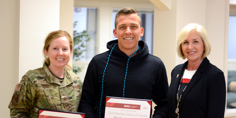 Dr. Heather Canary with outstanding faculty and graduate student