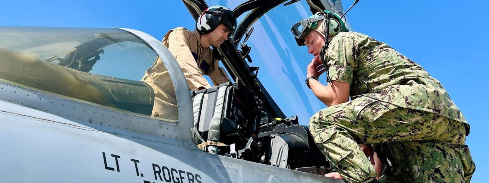 Above, LT Matthew “Dymbl” Perry discusses cockpit displays and controls with MIDN Aaron Johnson, a first-year at SDSU.  