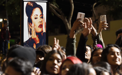 A portrait of the late singer Selena Quintanilla is seen in the crowd following a posthumous star ceremony for Quintanilla on the Hollywood Walk of Fame on Friday, Nov. 3, 2017, in Los Angeles.