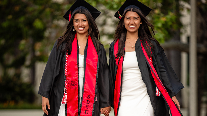 Identical twins Sabrina and Sydney Moreno will graduate side by side from San Diego State University May 2024.