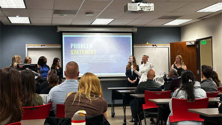 Photo caption: JMS Capstone students present the outcomes of their projects.