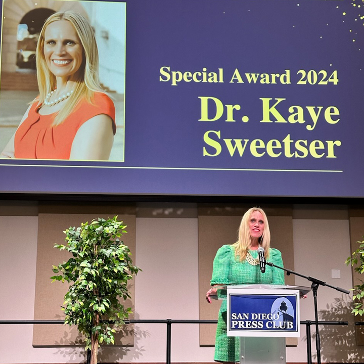 Dr. Kaye Sweester, a School of Journalism and Media Studies (JMS) professor, receiving the Andy Mace Award for Outstanding Contribution in Public Relations from the San Diego Press Club. 