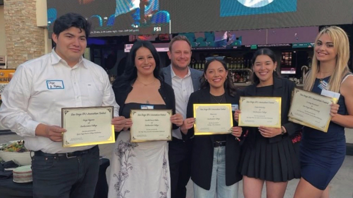 Lindsey Brintwood (right), social media editor for The Daily Aztec, celebrates her $1,500 Merit Scholarship at the 2025 SPJ San Diego Pro Chapter Awards ceremony.