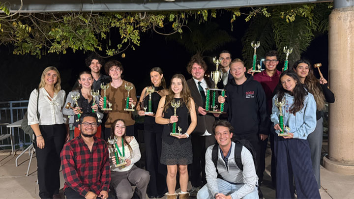 Our SDSU Forensics team proudly displaying their trophies after a record-breaking series of tournaments this fall.