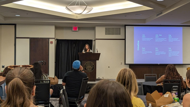 Aguilera addresses students in the Alumni Center Ballroom.