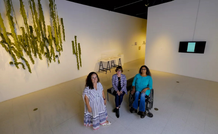 Art historian Amanda Cachia (from left), galleries and exhibition coordinator Chantel Paul and artist Bhavna Mehta in SDSU’s University Art Gallery, where a new exhibit, “Script/Rescript,” looks at the intersection of art and disability. (Nelvin C. Cepeda/The San Diego Union-Tribune)
