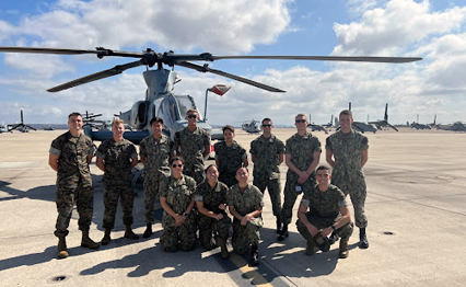 Navy and Marine Option midshipmen spend time acquainting themselves with the AH-1Z Marine Light Attack Helicopter.